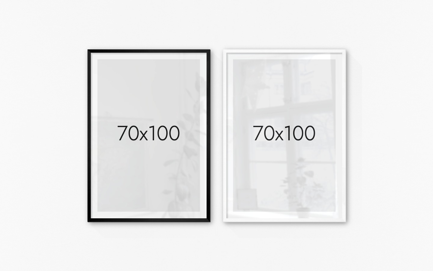 Tavelvägg med ramar i svart och vitt i storlekar 70x100