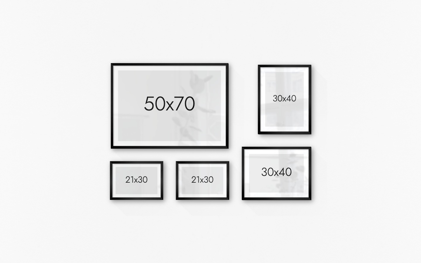 Tavelvägg med ramar i svart i storlekar 50x70, 21x30 och 30x40